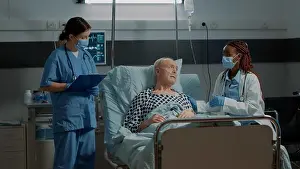 Oxygen Prints: Multi ethnic medical personnel monitoring patient health