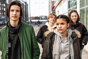 Front Views Prints: Multi-ethnic teenagers walking on sidewalk in city