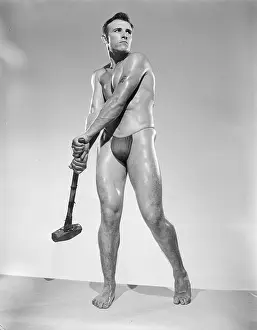 Attractive Prints: Muscular Nude Male Holds Sledge Hammer c.1956