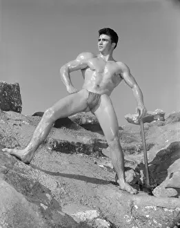 Gymnastic Prints: Muscular Nude Male on Rocky Hillside with Pick c.1965
