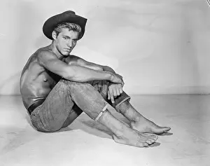 Muscular Shirtless Shoeless Cowboy Sits Thoughtfully c.1957