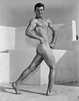Nude Prints: Muscular Young Nude Bodybuilder Flexing Outdoors c.1956