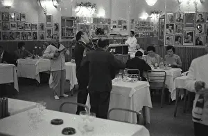 Mixed Prints: Musicians playing music instruments in a restaurant, Via Veneto, Rome, Italy