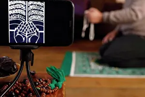 Interieur Prints: Muslim man pray at home during Ramadan. France