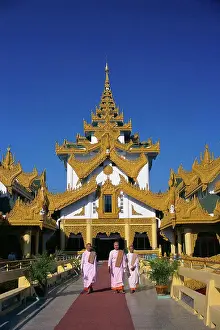 Bald Prints: Myanmar, view of young monks walking in front of Karaweik restaurant