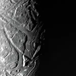 Ariel Prints: This NASA Voyager 2 view of Uranus moon Ariel's terminator shows a complex array of transecting valleys with