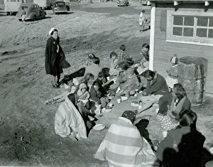 Sitting On Ground Prints: Native Americans Sit on Ground Eating While Woman Looks On ca 1938