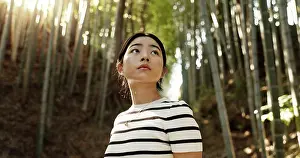 Nature, thinking and Japanese woman in bamboo forest for adventure on holiday
