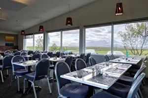 Cafeteria Prints: Neat empty cozy light hotel canteen with comfortable furniture on first floor near parking with windows overlooking