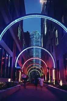 Alley Prints: Neon lighted archway in an alley in the West End historical district with Bank of America Building in the background