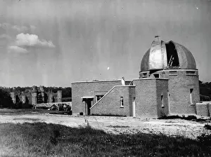 Telescope Prints: The new aluminium rotating dome which has been built outside the ancient battlements of Herstmonceux Castle so that