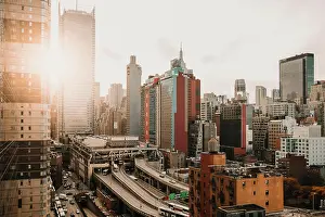 Sun Light Prints: New York city view with modern skyscrapers in district illuminated with bright sunlight