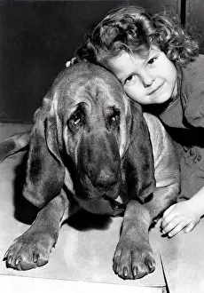 Breed Prints: New York, New York: 1947. A little girl gives a hug to Ramapo