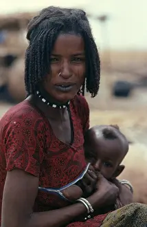 Arabic Prints: Nigeria, North, Shua Arab Woman Breast Feeding Her Child Wearing A Special Breast Feeding Dress With A Horizontal