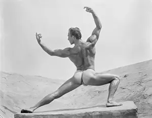 Attractive Prints: Nude Bodybuilder Posing on Rock Outdoors c.1953