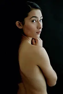 Straight Prints: Nude Hispanic woman looking over shoulder