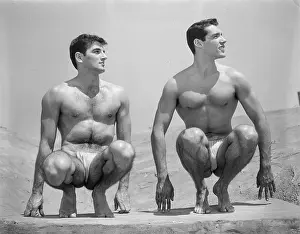 Bodybuilder Prints: Two Nude Muscular Male Young Men Pose Squatting c.1954