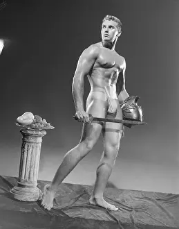 Bodybuilder Prints: Nude Roman Bodybuilder Looks Upward c.1956