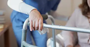Disability Prints: Nurse, mature woman and hands for medical assistance in retirement home for safety