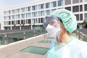 Baby Boomer Prints: a nurse is in protective gear against covid-19