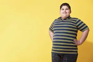 Overweight Prints: Obese boy standing and posing. (Obesity)