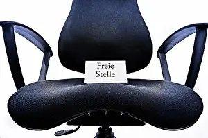 Place Of Work Prints: Empty office chair with a sign Freie Stelle