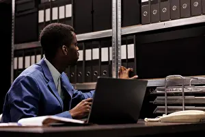 Analysis Prints: Officer looking at shelves