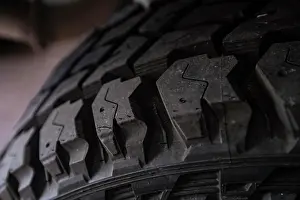 Tread Prints: Offroad tire tread ready to be mounted on the car