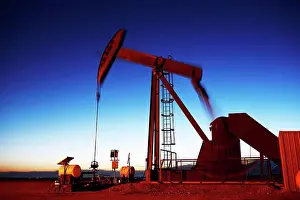 Global Warming Prints: Oil well pumpjack at dusk, eastern plains of Colorado, USA