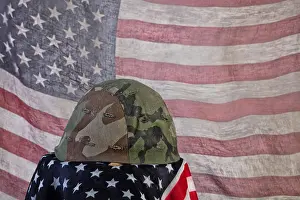 Nahaufnahme Prints: Old Army Helmet And Flag Old camouflaged army helmet and american flag Copyright: xZoonar