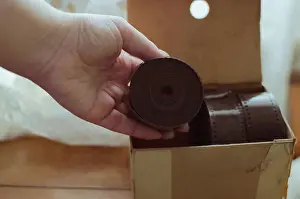 Film Prints: Old cardboard box with large reels of retro photo films