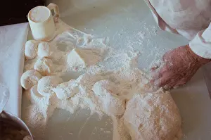 Flour Prints: Old hands of 90-year-old woman make pies with potatoes out of dough