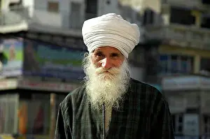 Looks Into The Camera Prints: Old Indian man wearing a white turban and beard, Delhi, Uttar Pradesh, India, Asia
