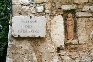 Skulptur Prints: Old medieval wall of stone building on Passage Des Sarrazins in ancient town in Eze Old medieval wall of stone building
