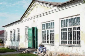 Bicycle Prints: Old peeling vintage building from 1971, bike against wall