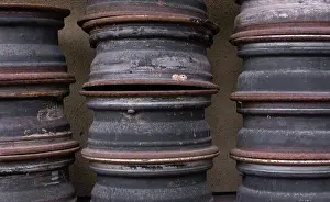 Ukraine Prints: Old rusty metal car rims folded in a garage