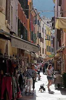 Historic District Prints: Old town alley with shops, tourists shopping