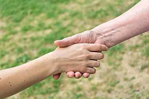 Oldest Prints: Old and young hands doing handshake