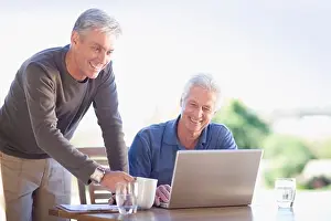 Worldwide Web Prints: Older men using laptop together