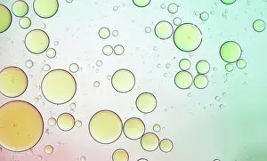 Colourful Prints: Olive oil drops suspended in water with colorful backgrounds