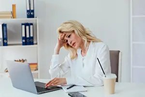 Multiethnic Prints: online communication woman with phone at laptop remote work conversation on skype internet