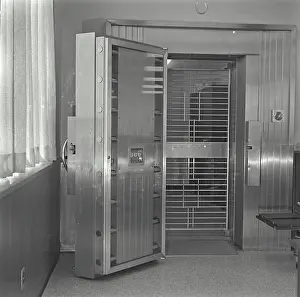 Banking Prints: Open door of bank vault