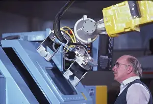 Bald Prints: Operator inspects robot-computer
