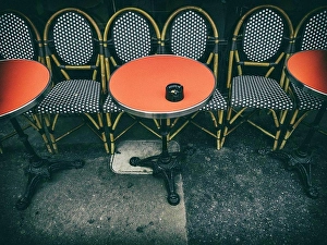 Intimate Prints: Outdoor restaurant seating in Paris, France