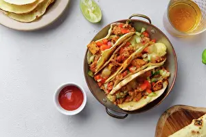 Cheese Prints: Overhead image of mexican tacos with chili con carne and grated cheese