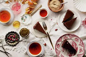 Cheese Prints: Overhead image of tea party with chocolate cheesecake slices on various plates