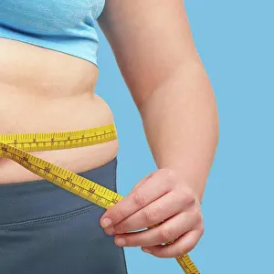 Measuring Prints: Overweight woman measuring waist