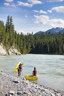 Manly Prints: Paddlers stop at the edge of a scenic river, B.C. Canada