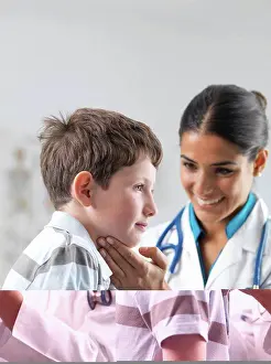 Physician Prints: Paediatric examination. Doctor checking a 7-year-old boy's glands to see if they are swollen
