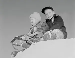 Only Boys Prints: Pair of children sledging in winter scenery
